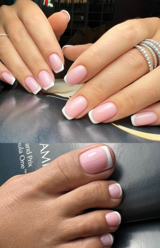 Nude manicure with French tips on a hand and a foot