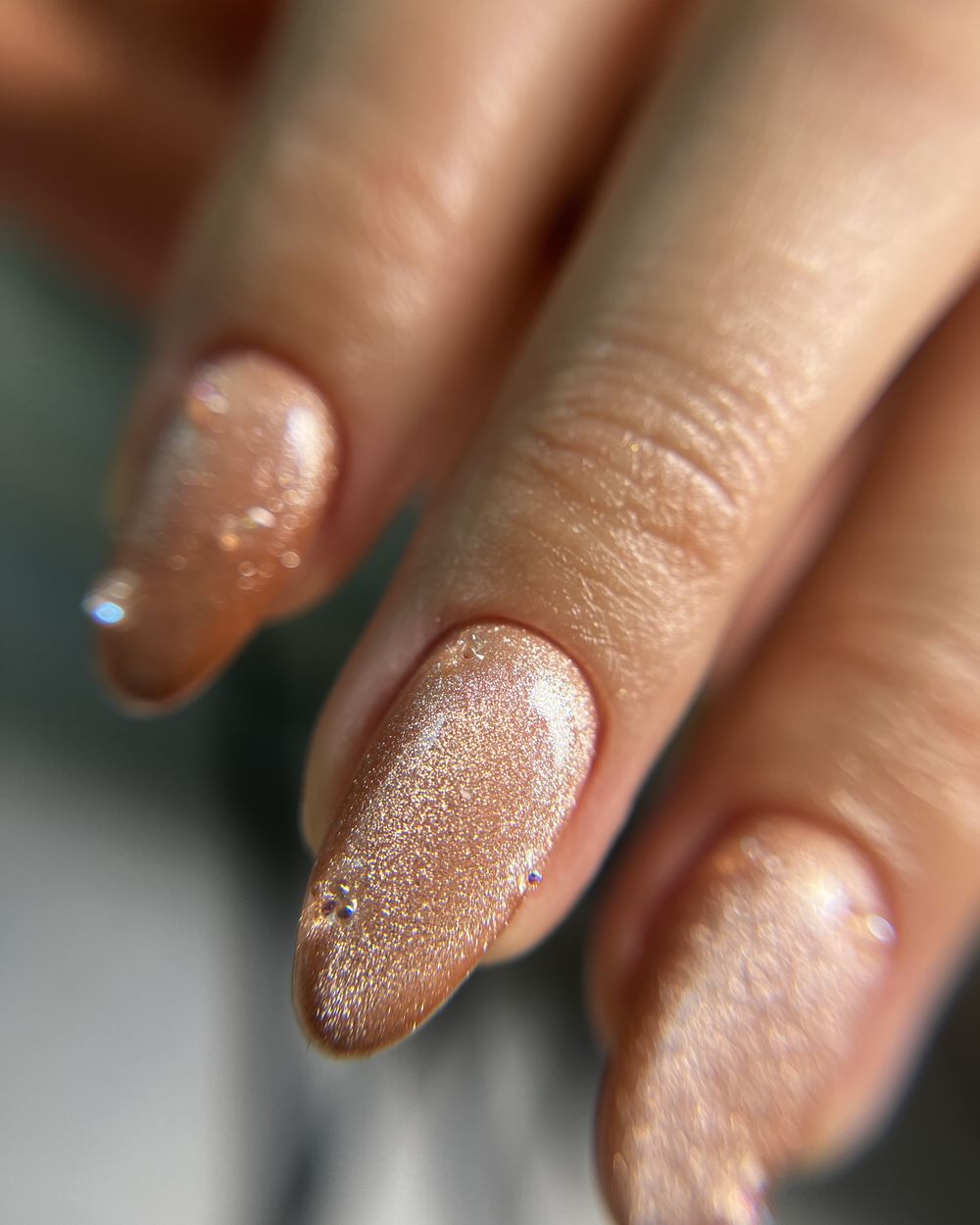 Close-up of a glitter nude manicure