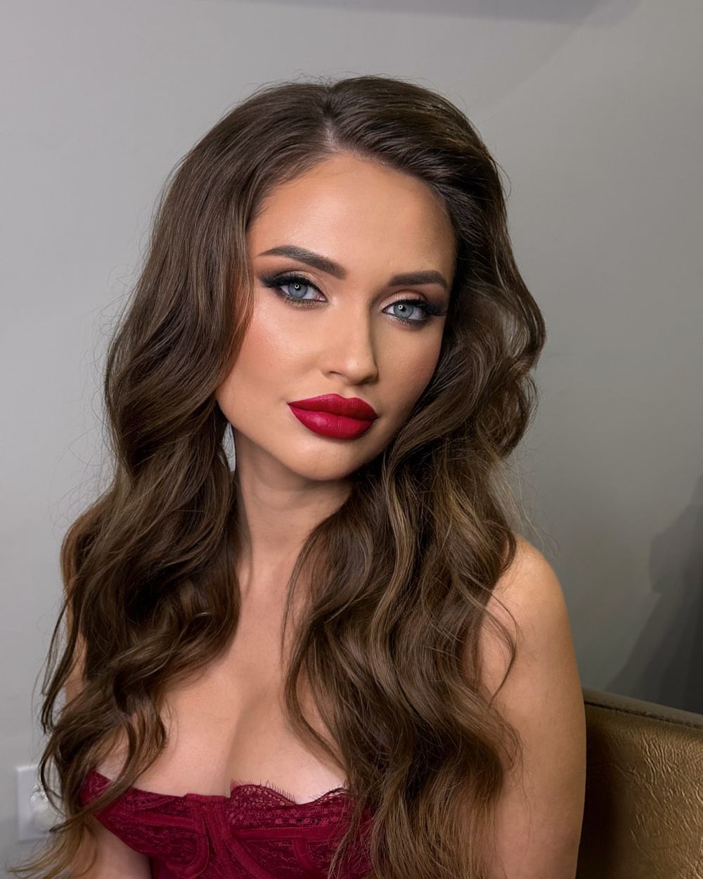 Finished makeup with a red lip